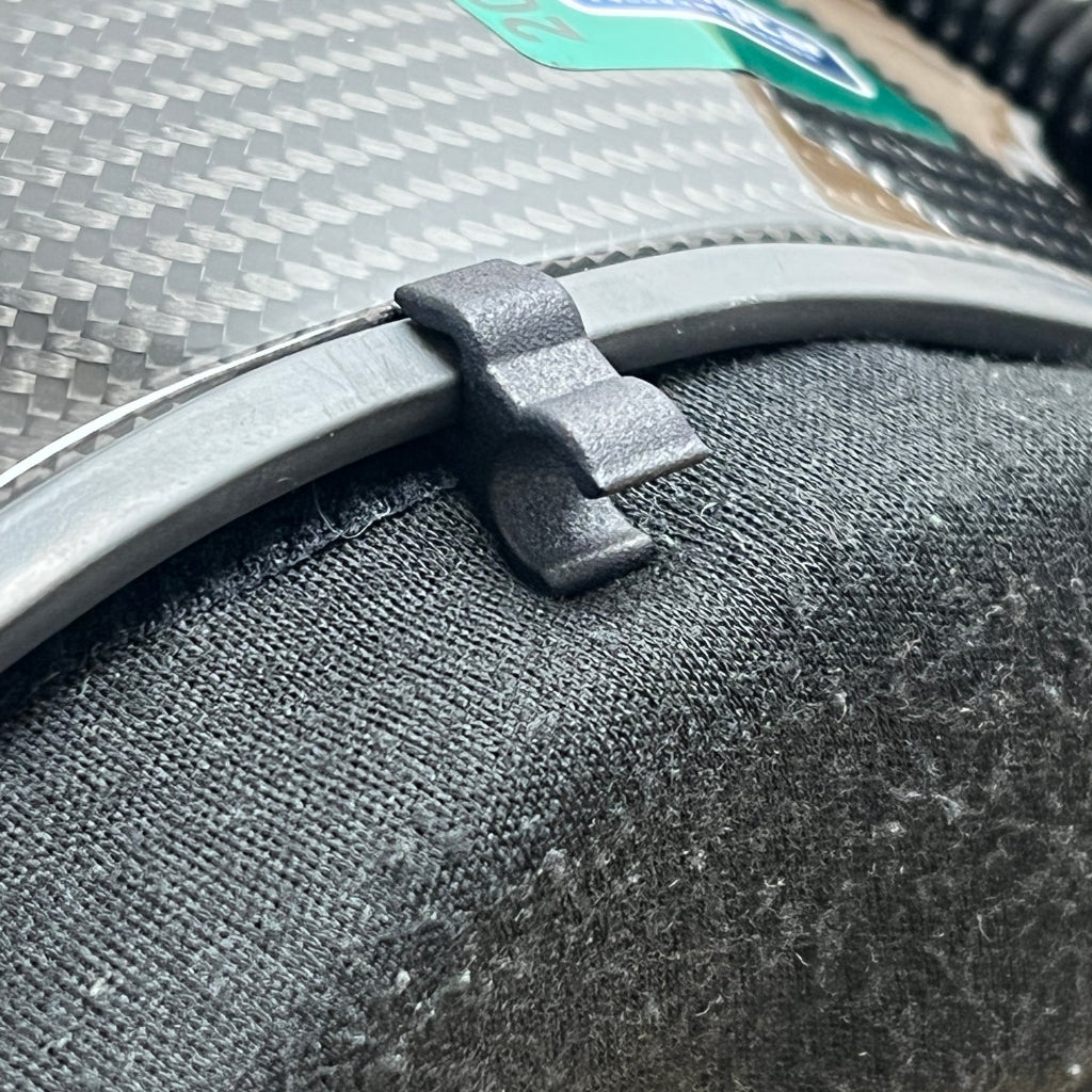 Close-up of Trac-Com earbud connector helmet clip