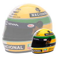 Thumbnail for A 1:2 scale replica of Ayrton Senna's helmet, featuring yellow, green, and blue colors with 'NACIONAL' and 'SENNA' branding, alongside its mirrored design.