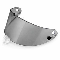 Thumbnail for A dark gray tinted motorcycle helmet visor lens with a clear plastic nose clip, shown on a plain white background.