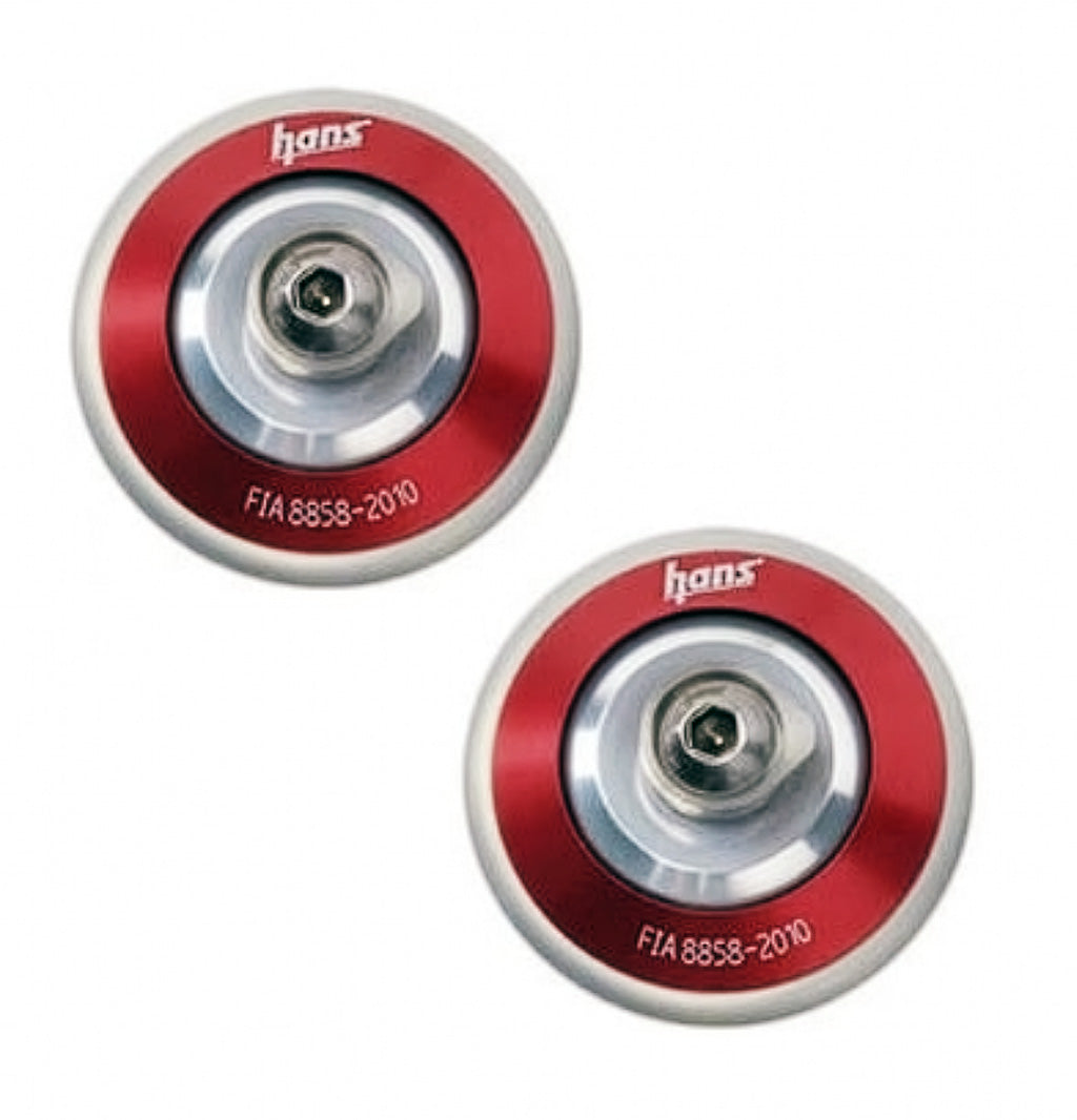 Pair of red anodized HANS post anchors installed on a helmet
