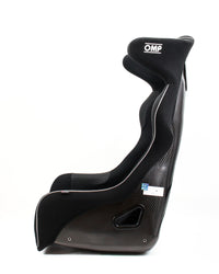 Thumbnail for A black OMP racing bucket seat with a carbon fiber pattern side panel, white piping, and a white OMP logo on the headrest, shown from a side profile on a white background.