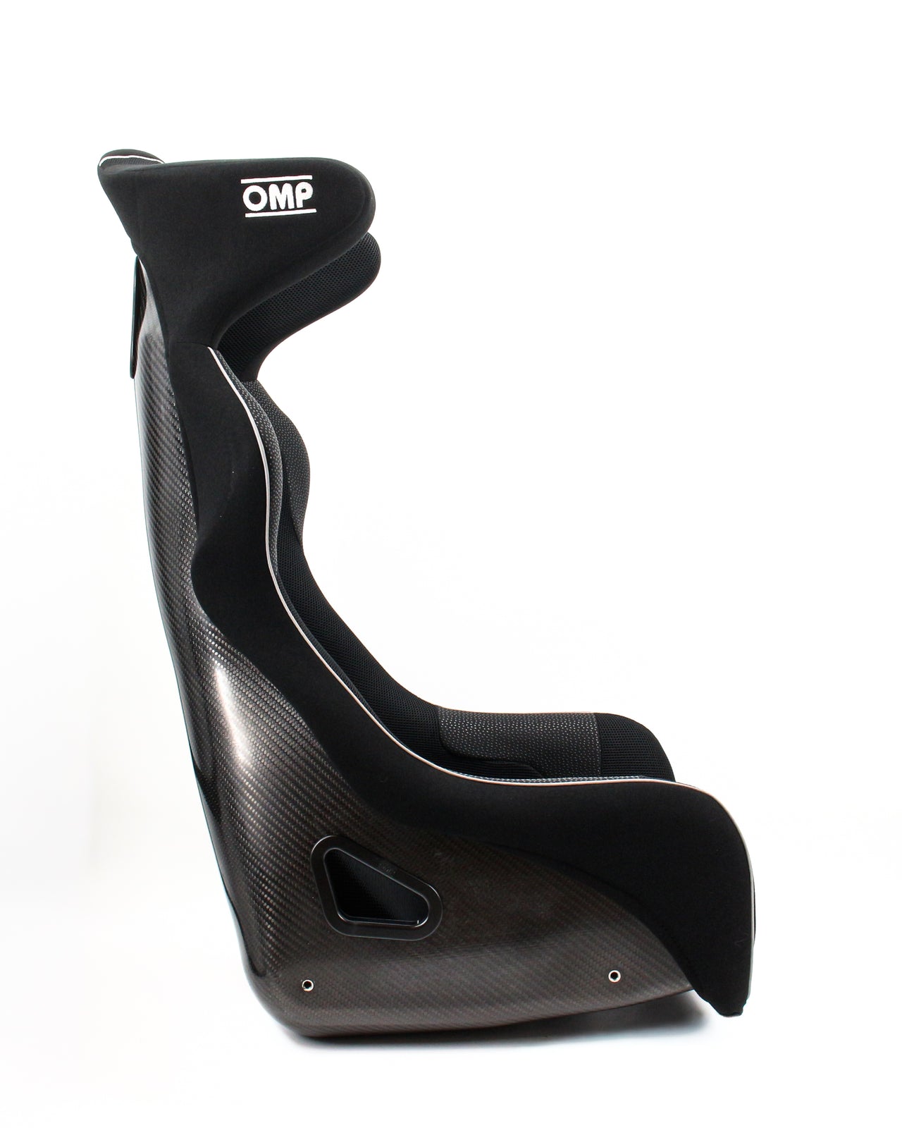 A black OMP racing bucket seat with a carbon fiber weave pattern and white contrast stitching, shown from a side profile view on a white background.