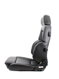 Thumbnail for A Recaro black leather car bucket seat with an integrated headrest, shown in a side profile view against a solid white background.