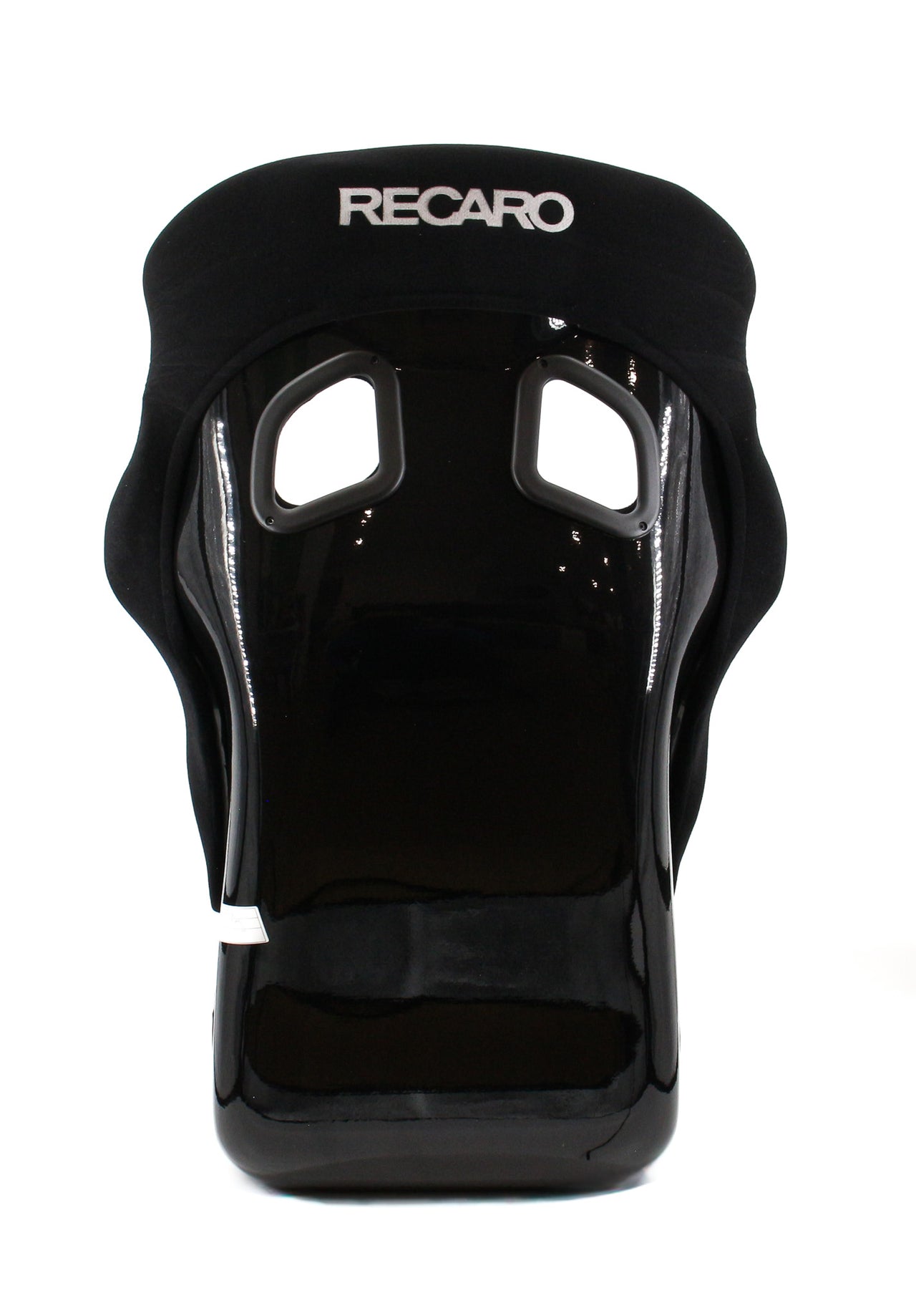 A Recaro Pole Position shell with a glossy patent finish, featuring two eye cutouts and the Recaro brand name printed in white on the forehead area.
