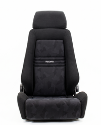 Thumbnail for A black Recaro car seat with a abstract pattern on the center and lower sections, shown from a front-facing perspective on a white background.