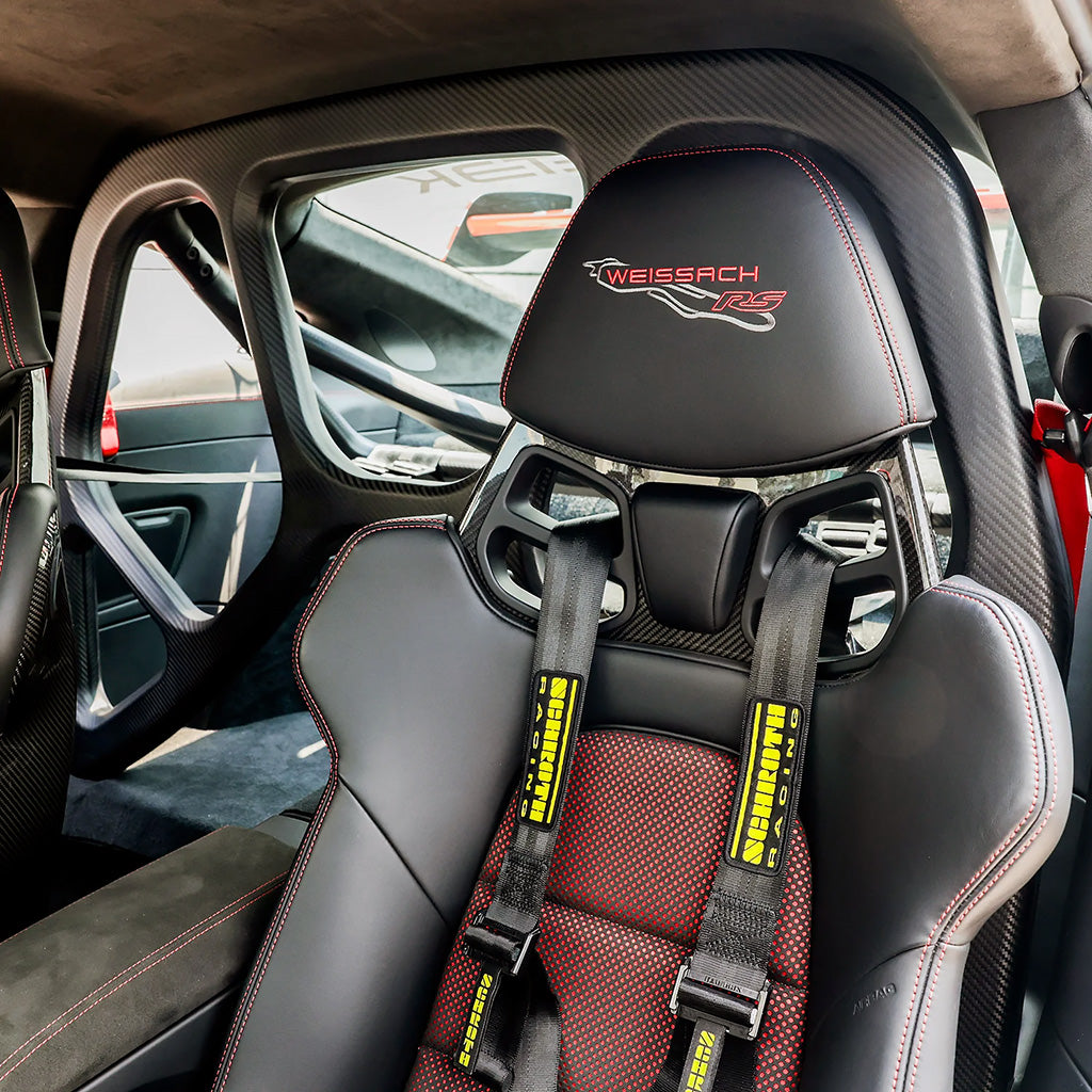 Driver-side view of SilverRocket roll cage in Porsche 992 GT3 cockpit
