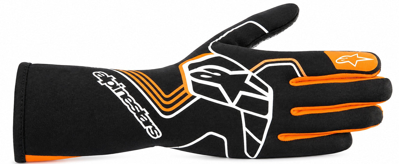 A single Alpinestars racing glove in black, featuring white and orange graphics, including the brand name and logo, on a plain white background.