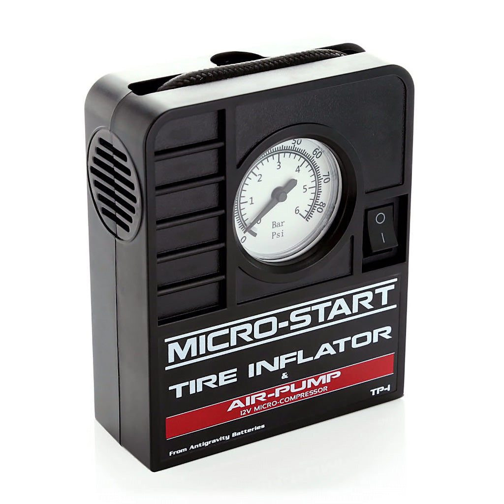 Close-up of Antigravity tire inflator pressure gauge and brass air fitting