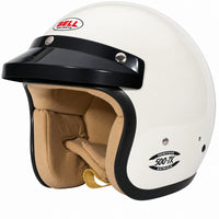 Thumbnail for Bell 500-TX Classic Vintage Open-Face Racing Helmet in Gloss Heritage White, shown from a front three-quarter angle featuring a fiberglass composite shell, removable black racing peak, tan fire-resistant interior, M6 HANS mounting provisions, and classic Bell Heritage Series branding on a clean white background.