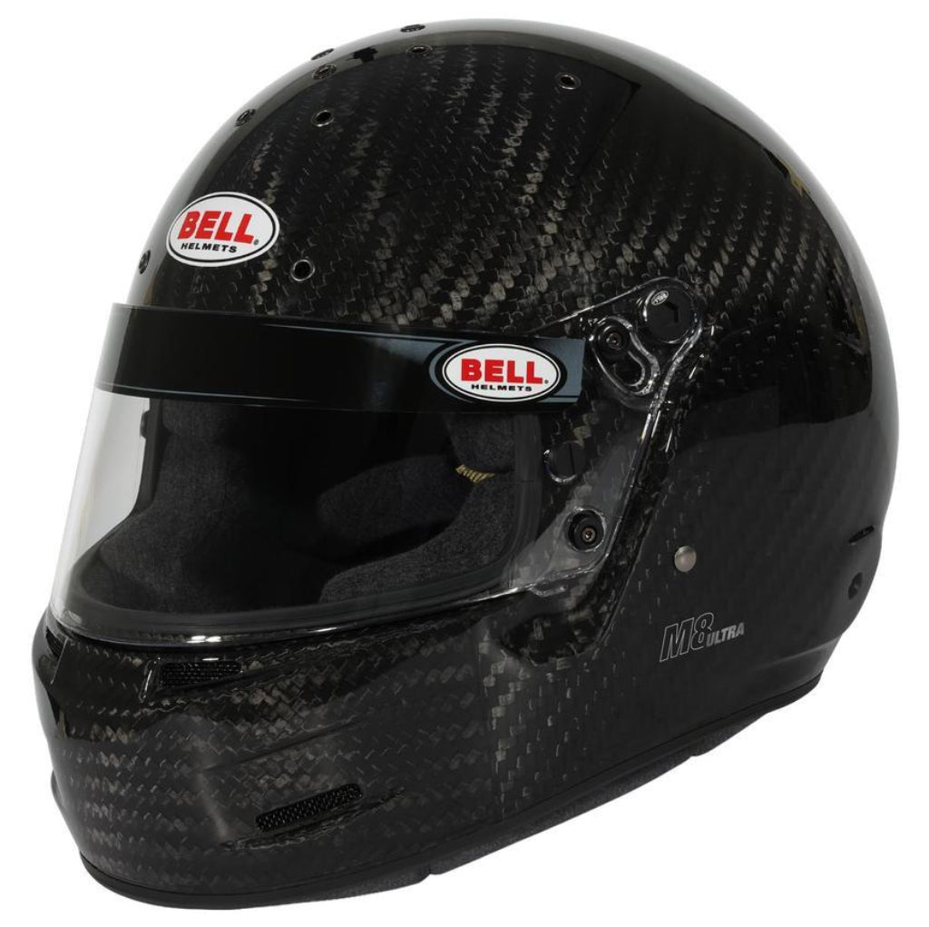 Bell M8 Ultra Carbon helmet front three quarter view showing carbon fiber shell and visor