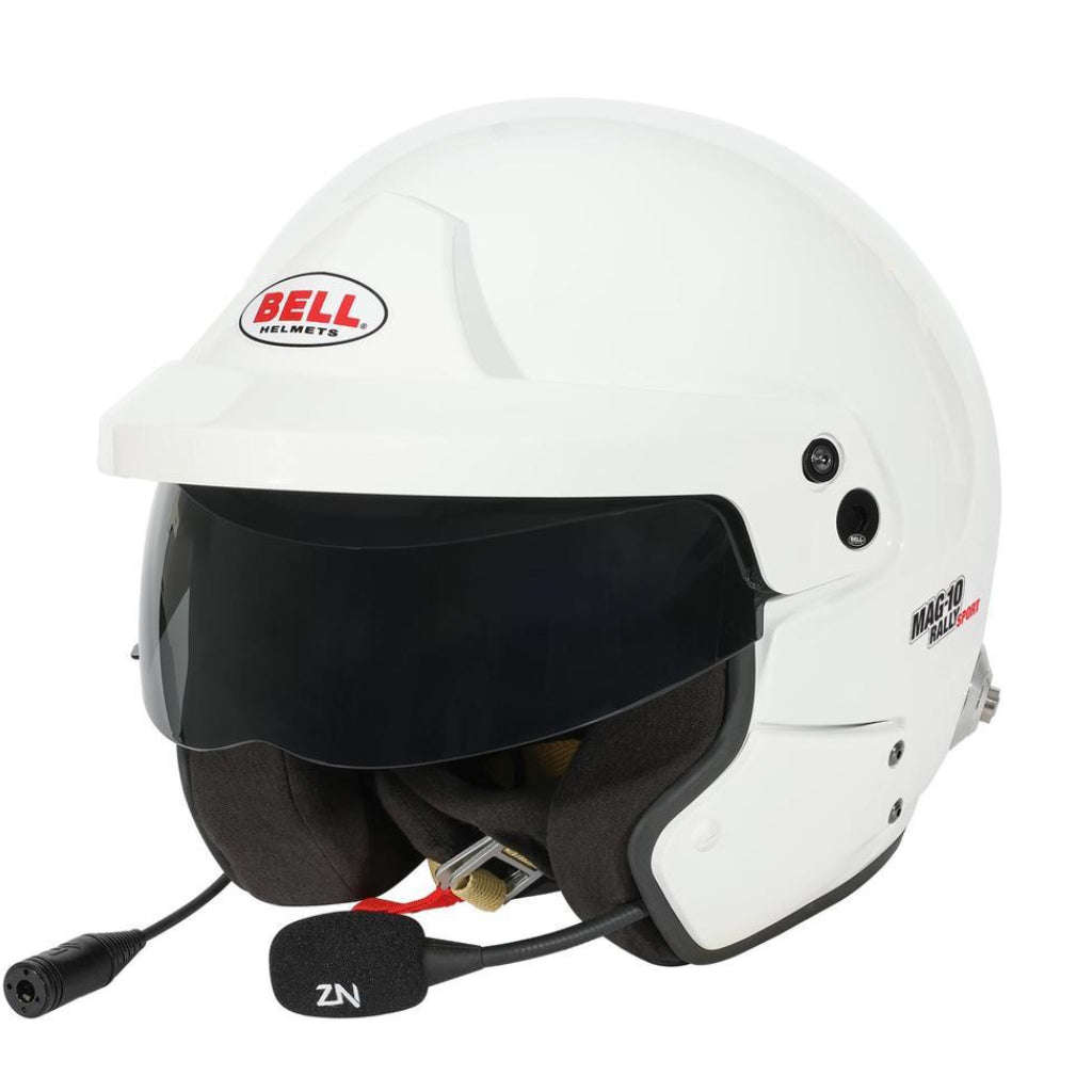 Bell MAG-10 Rally Sport white open-face helmet shown at an angle with dark visor, integrated microphone, and ear cushions visible image