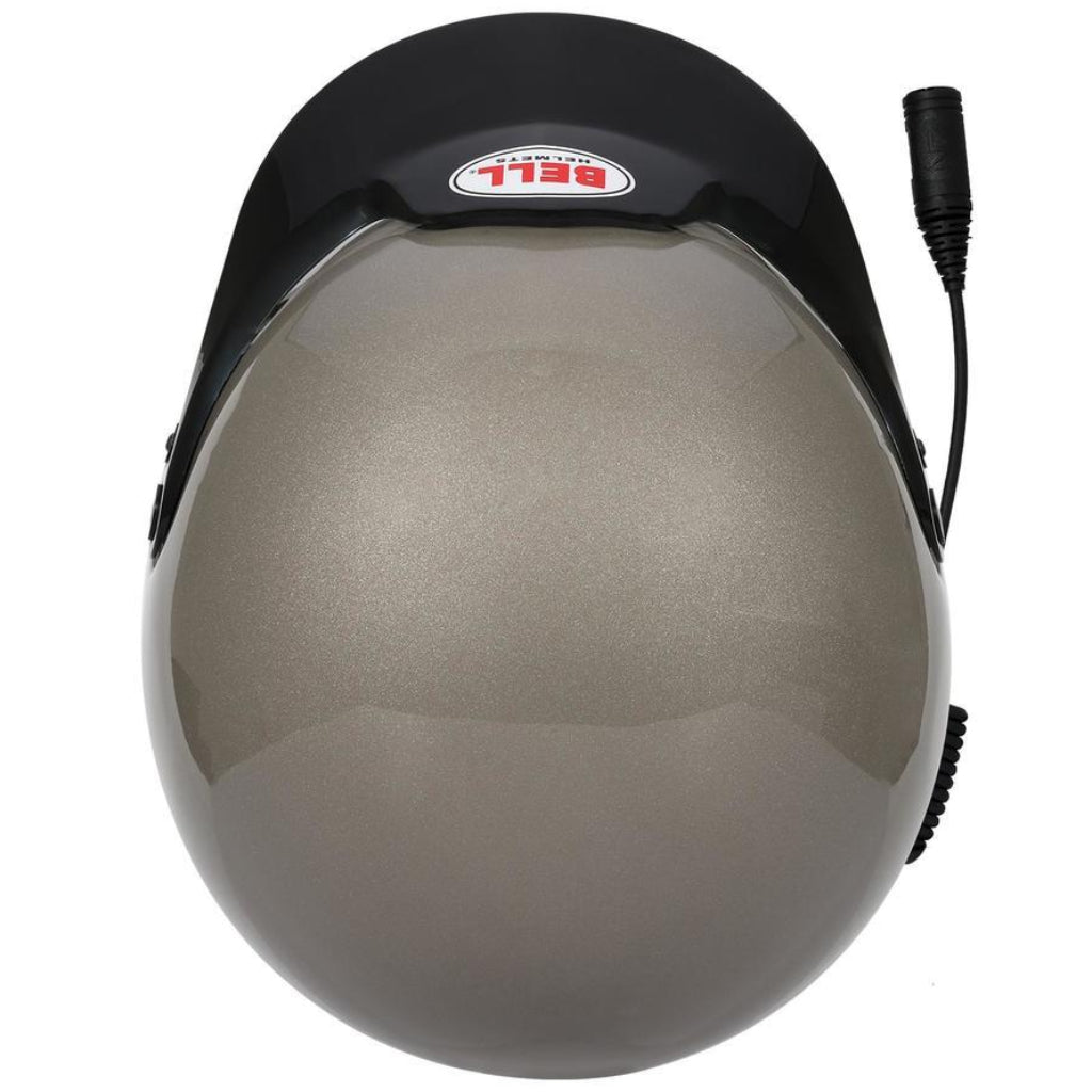 Bell MAG Rally Sport helmet titanium top view showing smooth shell and visor peak image