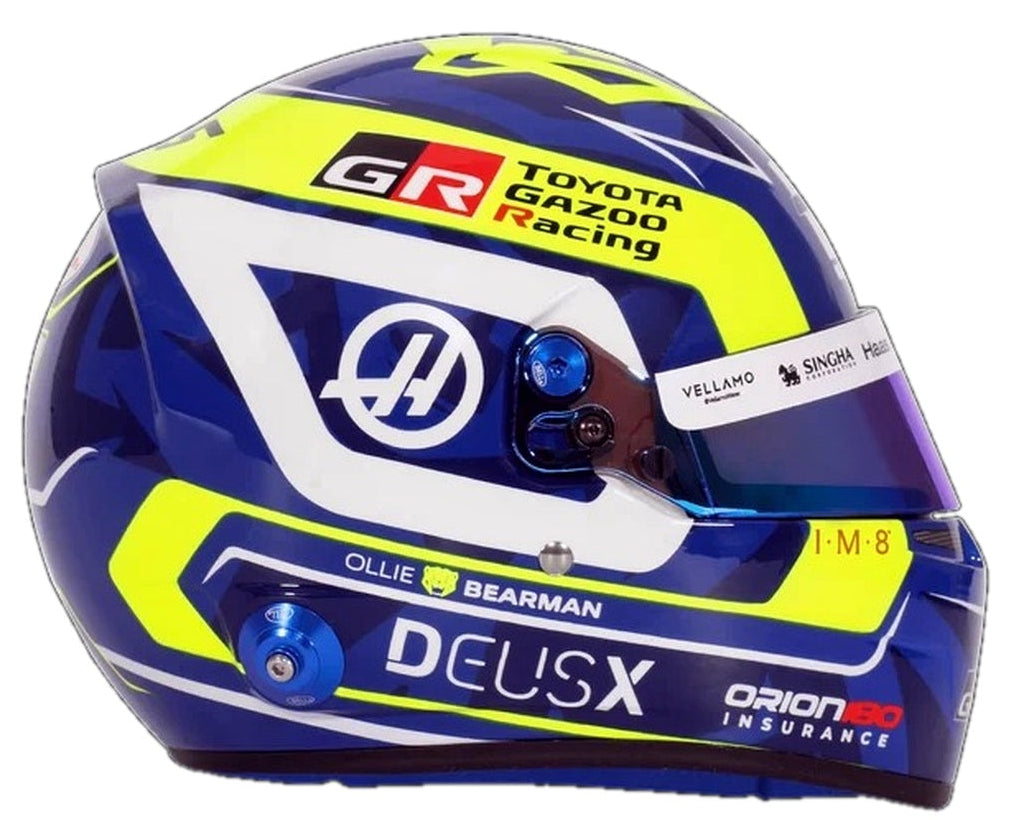 ell Oliver Bearman 2026 F1 mini helmet right side view with blue, yellow and white Haas graphics