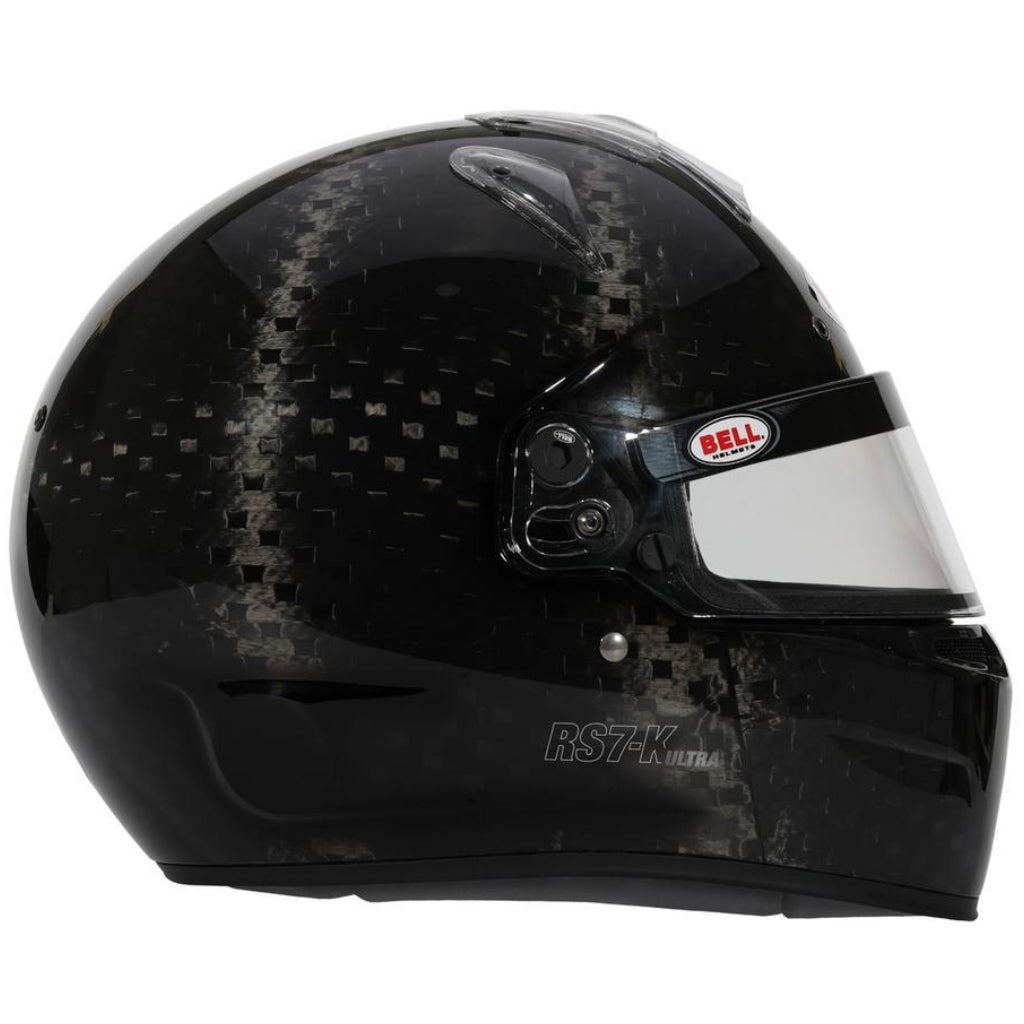 Bell RS7-K ULTRA carbon helmet right side view emphasizing carbon fiber finish and aerodynamic shell shape image