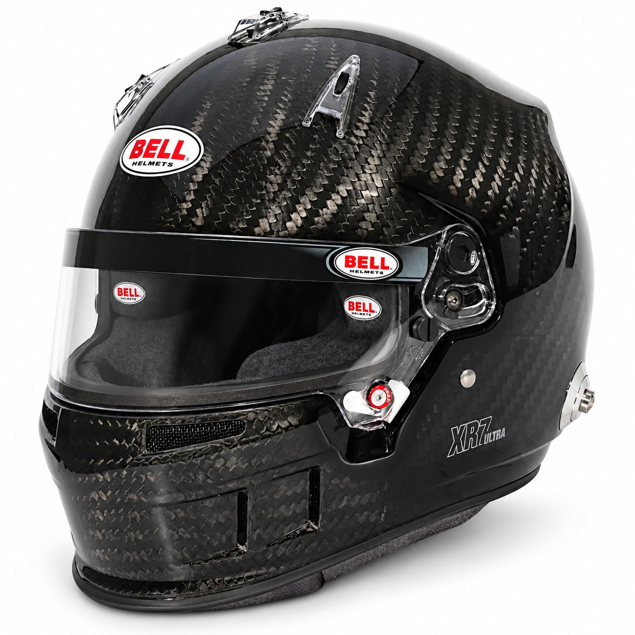 Bell XR7 ULTRA Carbon Fiber SA2025 racing helmet shown from the front three-quarter angle on a white background