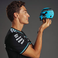 Thumbnail for George Russell Formula 1 driver admiring his Bell replica mini-helmet