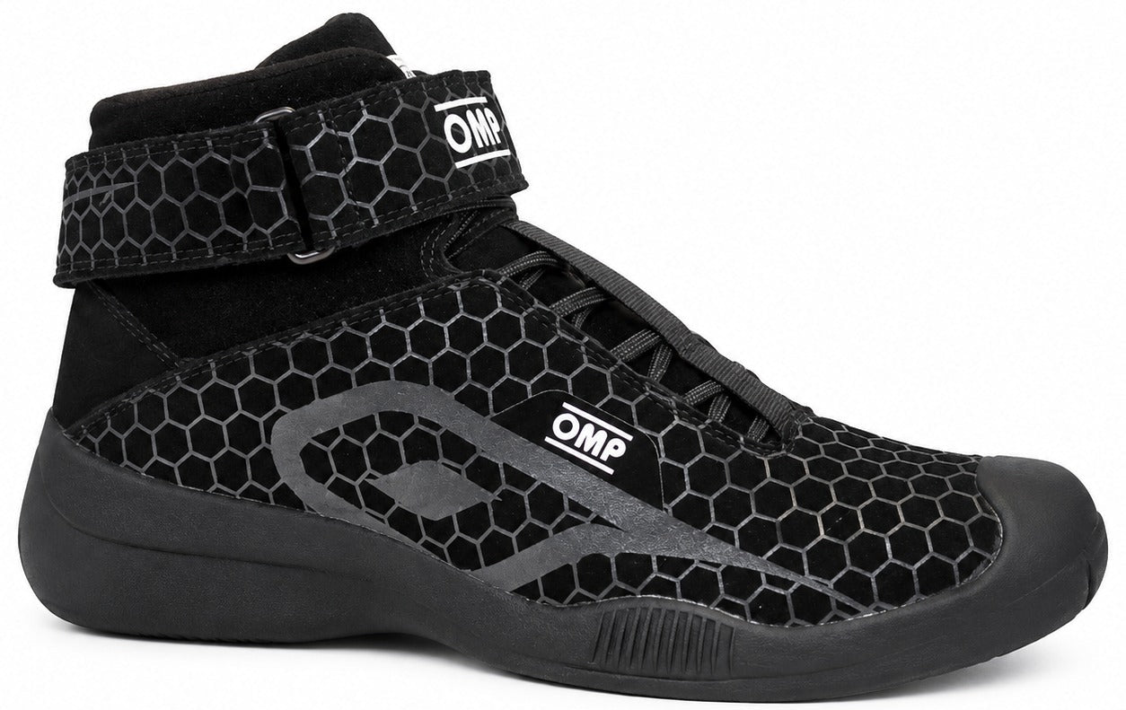 OMP Pit Crew OTW shoe in black with a honeycomb pattern, shown in a right-facing side view on a white background.