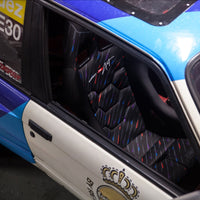 Thumbnail for OMP WRC-R Art Racing Seat full view inside a race-prepped BMW with blue and white livery