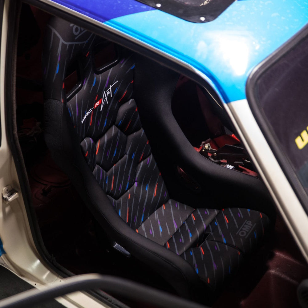 OMP WRC-R Art Racing Seat side profile view installed in a car