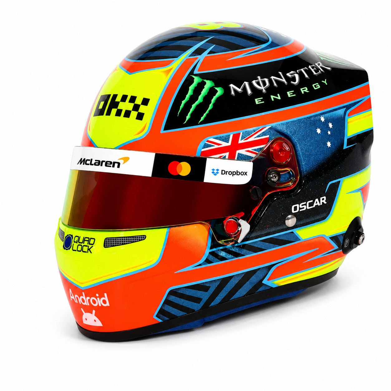 Oscar Piastri 2026 F1 mini helmet angled left view with McLaren branding and collector display box
