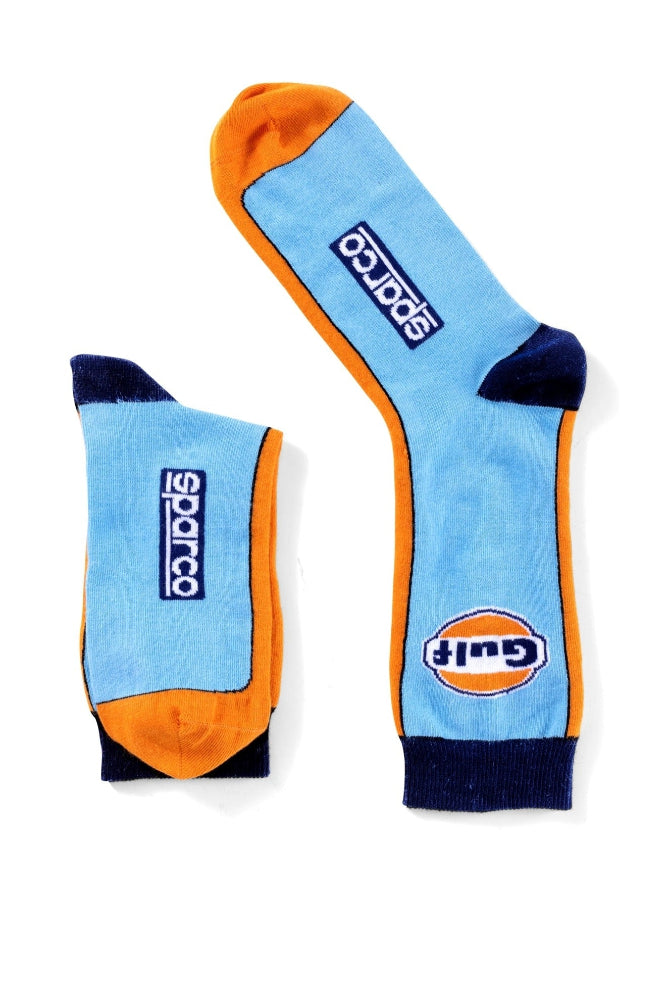 Top-down view of the Gulf Heritage Socks by Sparco, highlighting both logo placements and the vibrant retro racing color scheme.