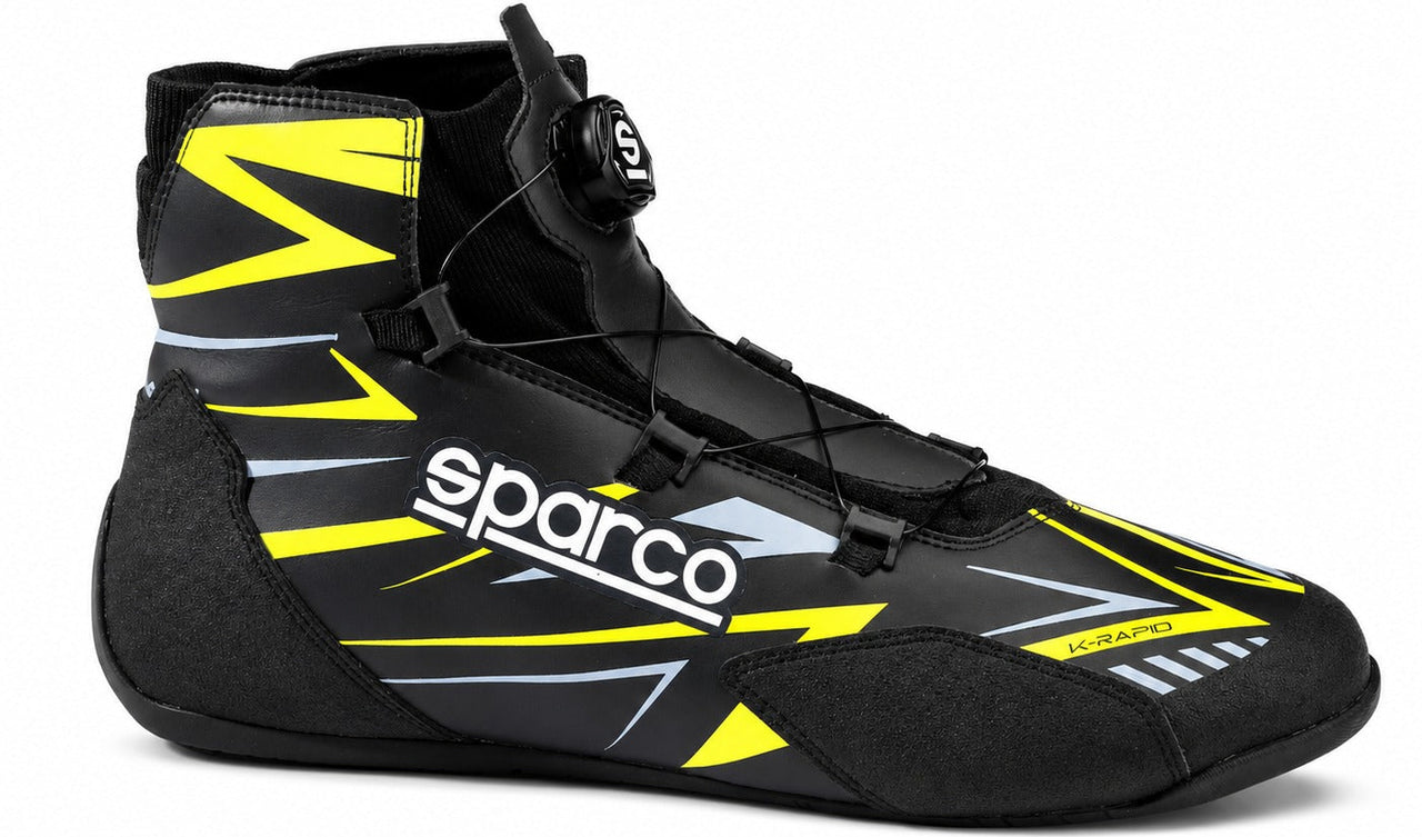 Sparco K-Rapid kart racing shoe in navy and fluorescent yellow, shown in a straight right-facing side view on a white background.