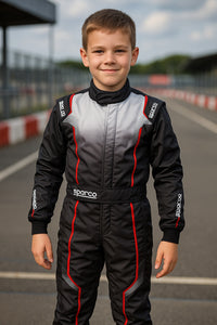 Thumbnail for Sparco Prime-KS kart racing suit on kid front view at track - black gray red