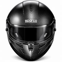 Thumbnail for Sparco Stealth KF Carbon Fiber karting helmet front view featuring an exposed black carbon fiber shell, dark visor, central locking mechanism, chin ventilation, and white Sparco branding.