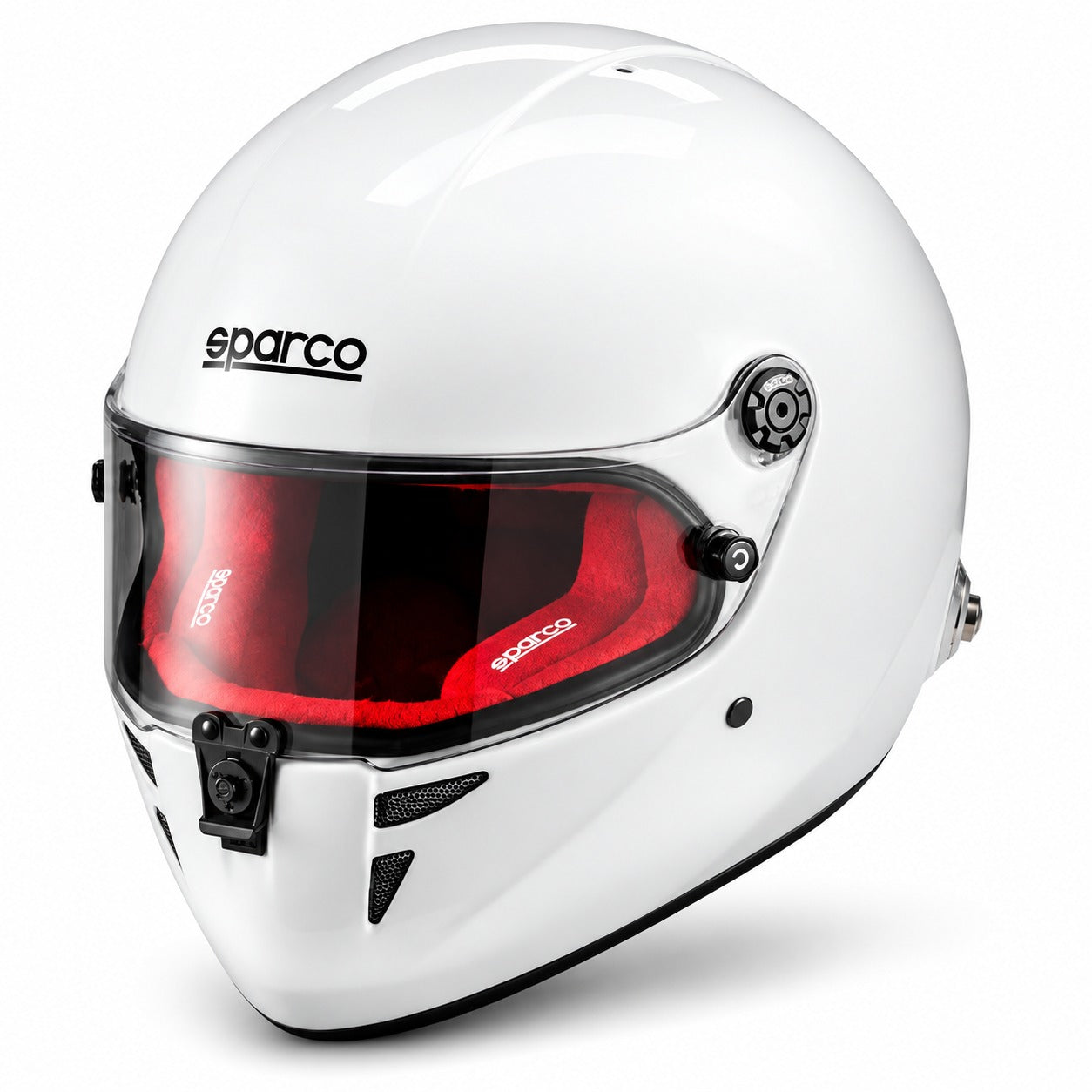 Sparco Stealth RF SA2025 racing helmet in gloss white with red fire-resistant interior, shown in a front three-quarter view featuring a lightweight composite shell, clear visor, central locking mechanism, chin ventilation, and FIA 8859-2024 certification.