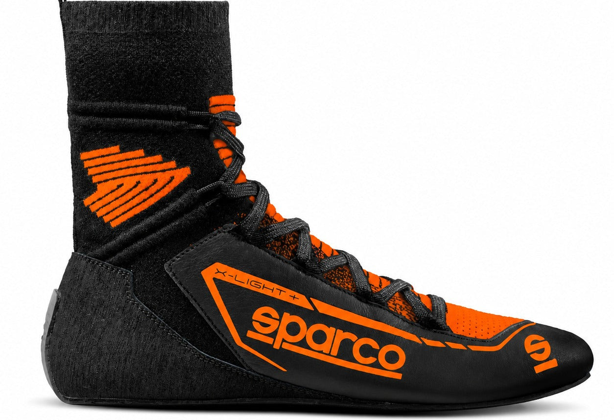 Sparco X-Light Racing Shoes in black and orange, single right-facing racing boot with high sock-style ankle, black laces, orange Sparco branding, and slim low-profile sole.