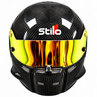 Thumbnail for Stilo ST5.1 GT Carbon Fiber SA2020 racing helmet shown from the front, featuring a glossy exposed carbon fiber shell, gold and yellow iridium mirrored visor, center shield locking mechanism, integrated chin ventilation, and Stilo branding on a clean white background.