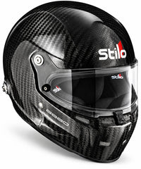 Thumbnail for Stilo ST5 GT Carbon Fiber Racing Helmet with FIA 8860-2018 certification, shown in a left-front three-quarter view featuring a glossy exposed carbon fiber shell, clear anti-fog visor, center shield locking mechanism, integrated chin ventilation, HANS anchor, and Stilo branding on a clean white background
