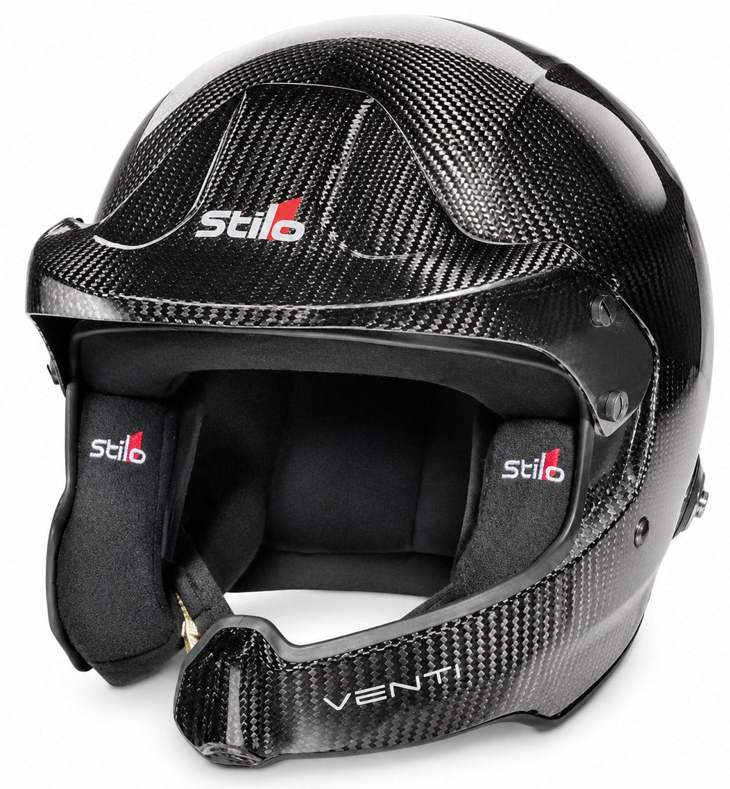 Stilo Venti WRC Carbon Fiber Racing Helmet shown from a left three-quarter angle with carbon shell, rally peak, integrated padding and HANS posts